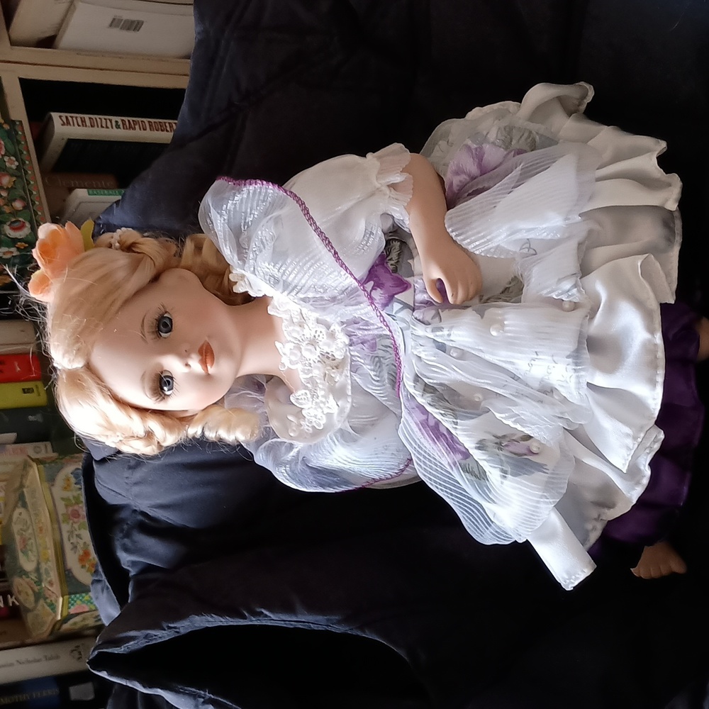 Pretty Porcelain or Ceramic Sitting Blond Doll, Purple & White Satin Dress